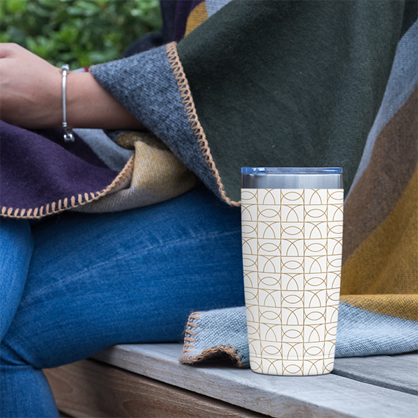 Image of coffee mug with branded pattern.