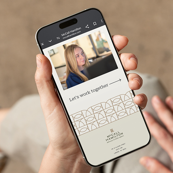 View of McCall Hamilton website on mobile phone.