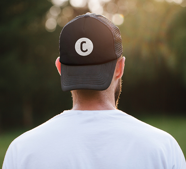 Man in sports cap featuring the Charlotte icon