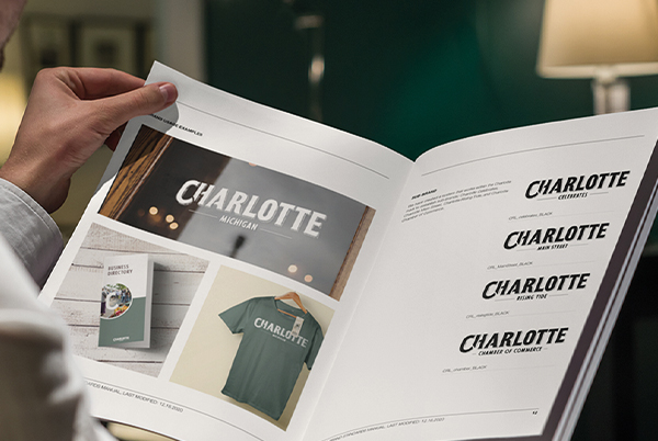 Person viewing the Charlotte brand book