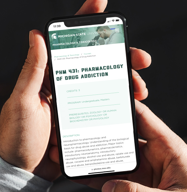Phone displaying the MSU Department of Pharmacology and Toxicology website