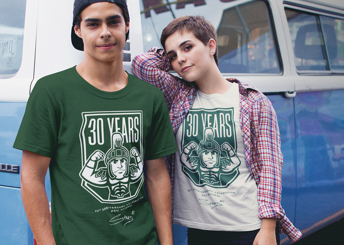 Two students wearing sparty branded t-shirts