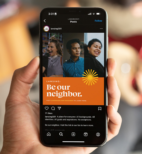 Social ad for the "Be Our Neighbor" campaign displayed on an iPhone