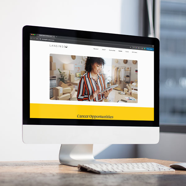 Desktop computer with the Careers page of the Lansing 5:01 site pulled up