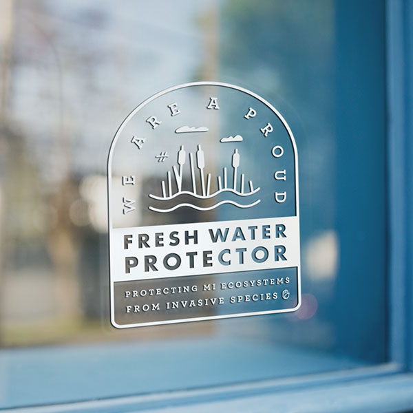 Window cling for business's reading, "we are a proud fresh water protector"