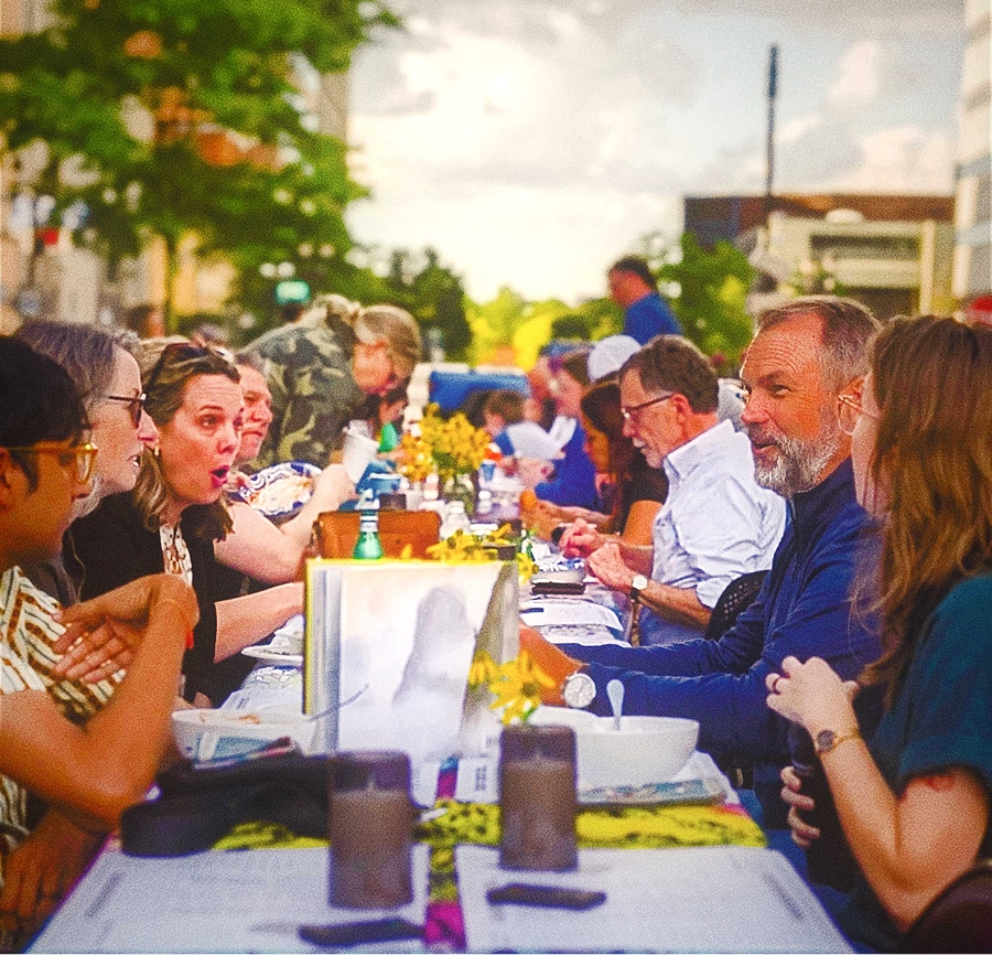 People dining and connecting at Stone Soup event