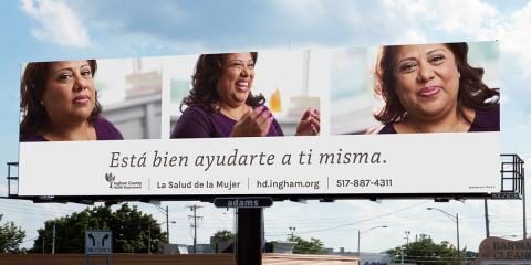 Billboard featuring a happy, healthy woman